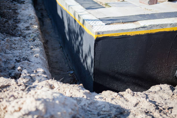 Professional Emergency Waterproofing technician working in Harrison, NY